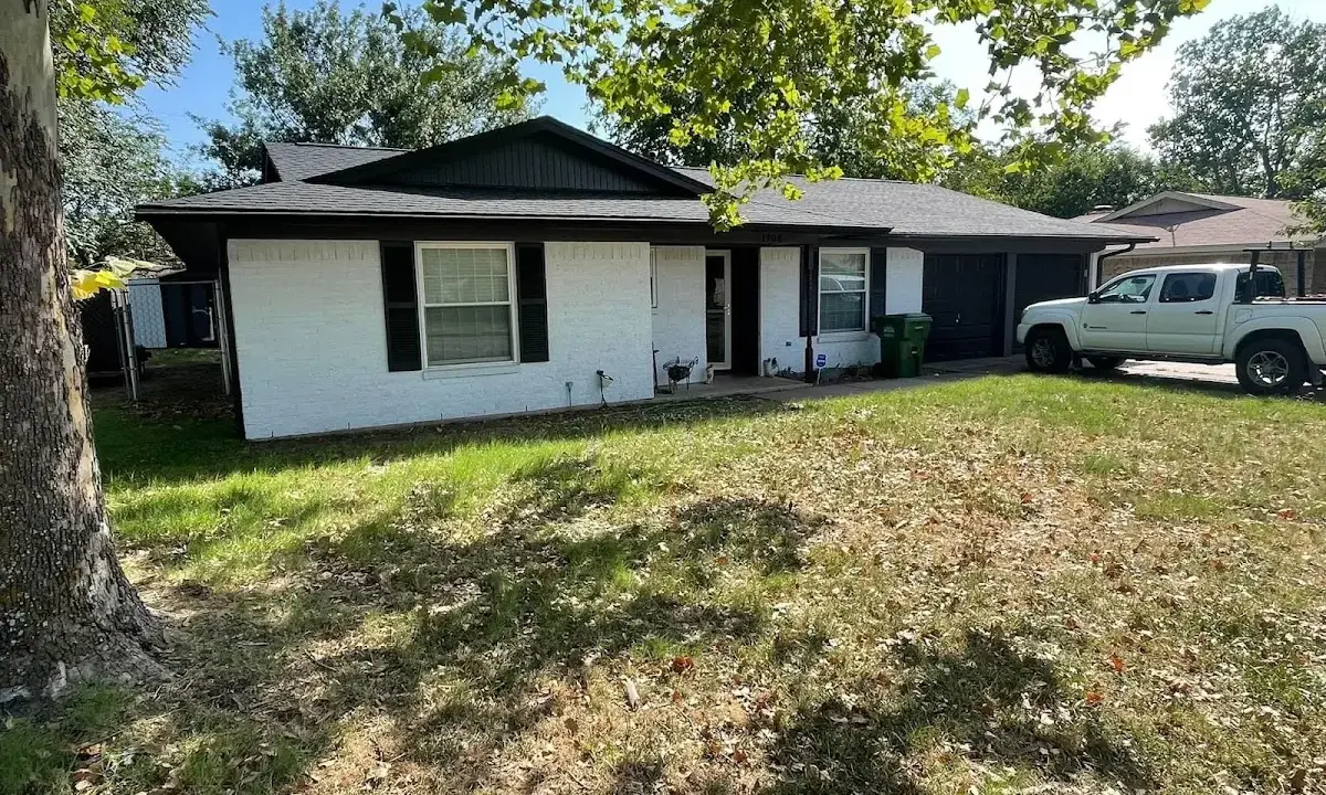 Professional roofing crew working on a residential roof in Mount Joy